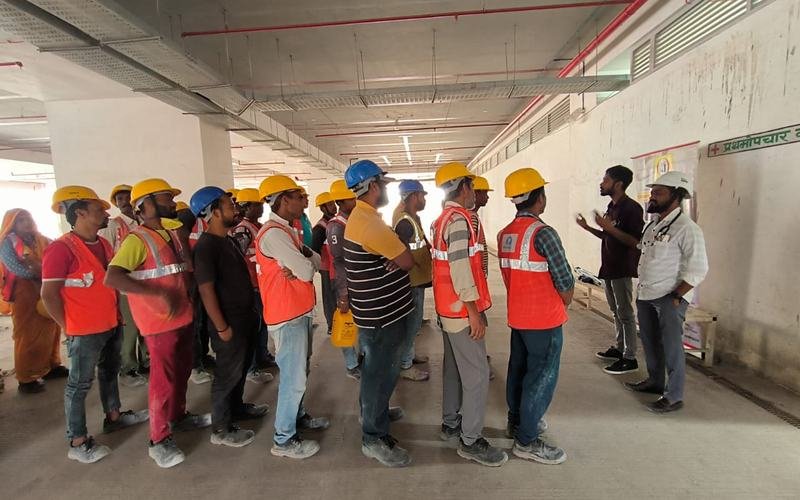 Workers queuing at a Synergy Health Foundation screening camp