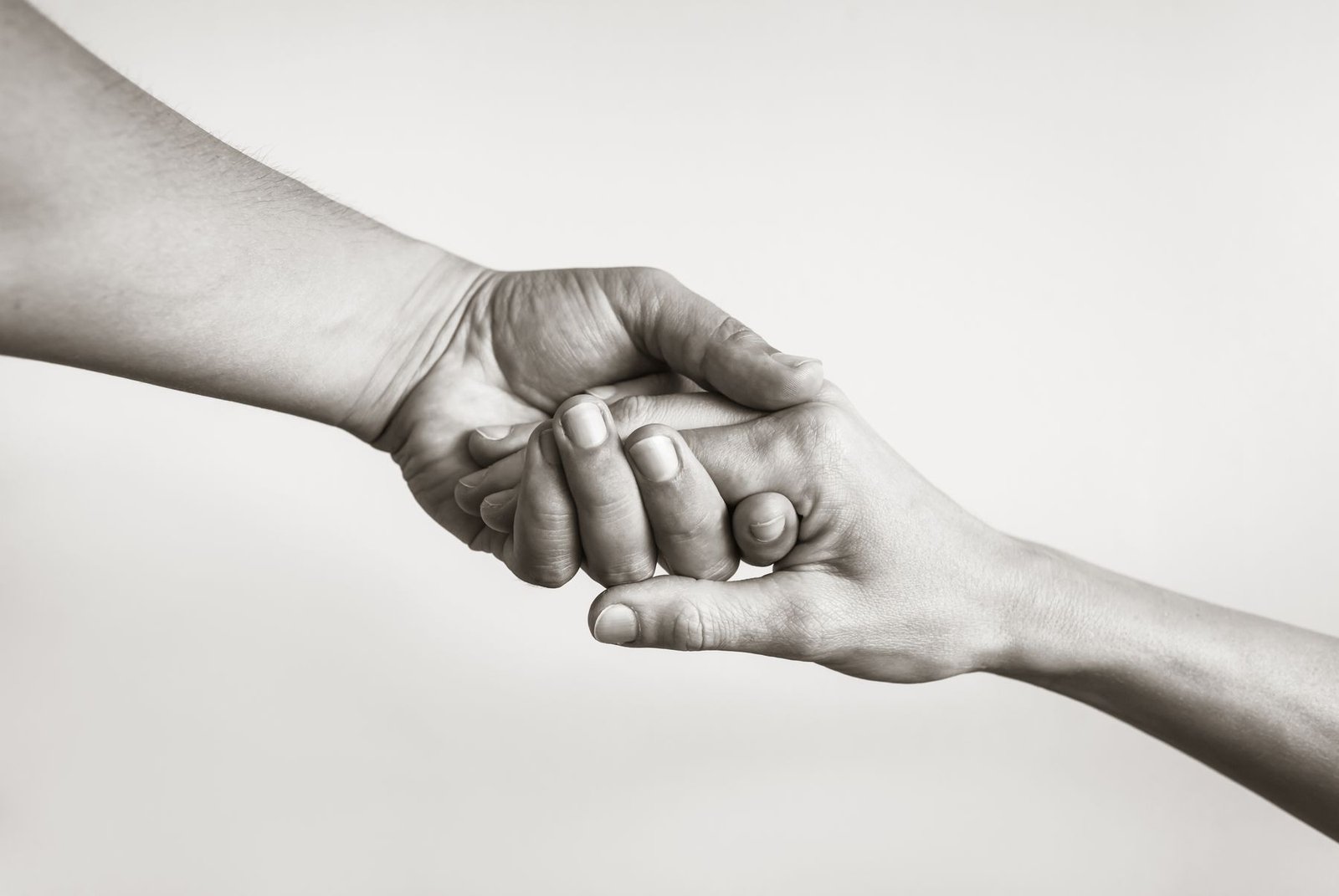 One hand steadying another